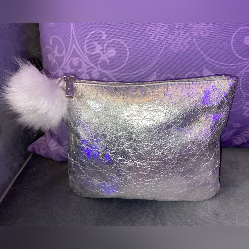 MAC small silver metallic cosmetic bag.